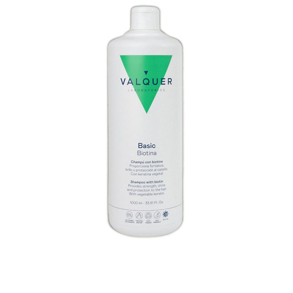 Flacone di shampoo bianco con logo triangolare verde. Testo: VALQUER, Basic Biotina. Contiene testo su forza, lucentezza, protezione con ingredienti vegetali.