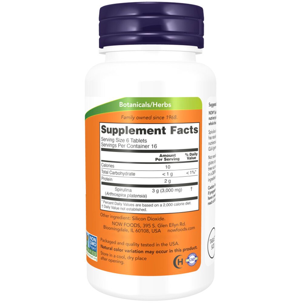 Retro del flacone. Scritta: Supplement Facts, Spirulina, 3 g. Sfondo arancione, testo bianco.