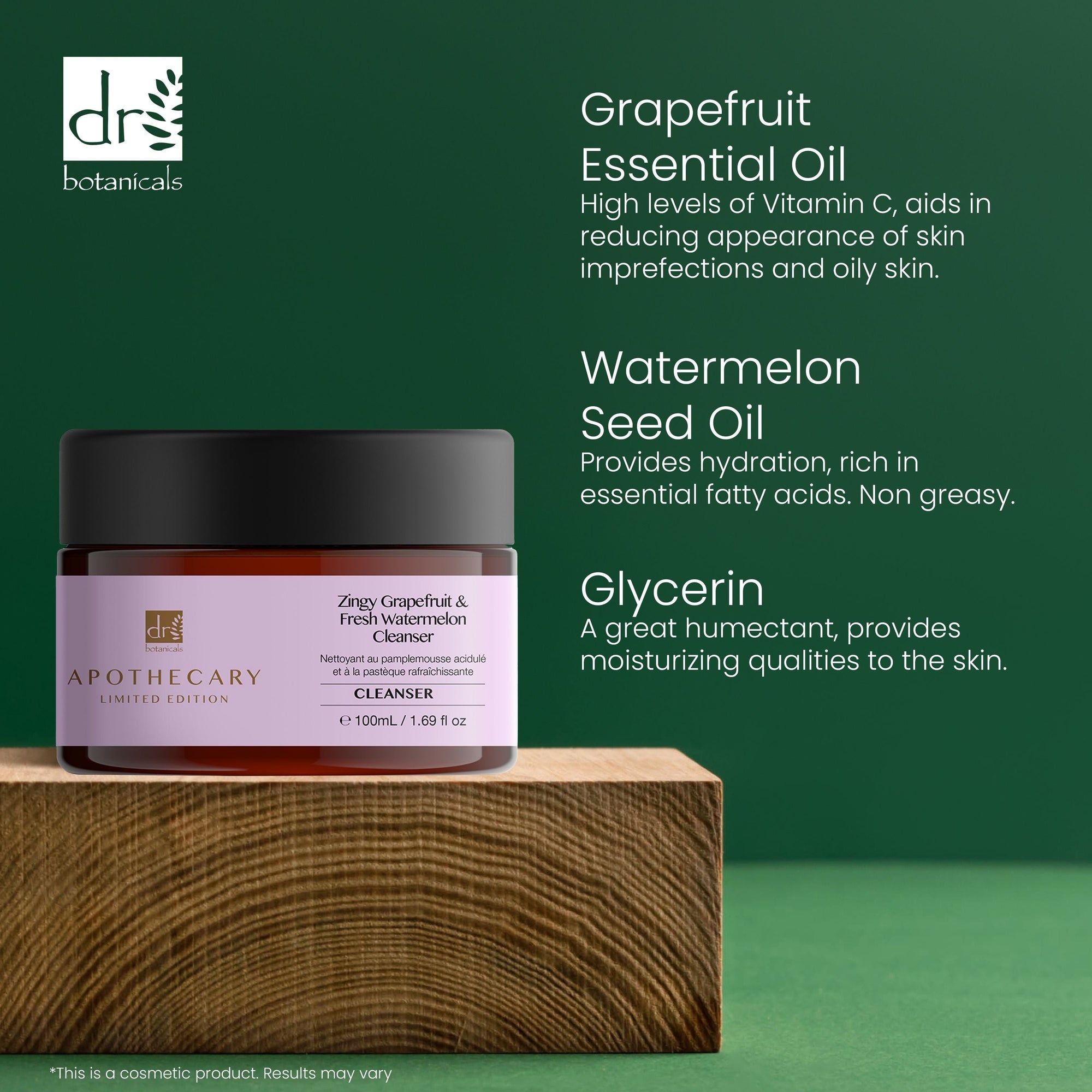 Vaso marrone con coperchio nero. Etichetta con nome del prodotto e marchio. Testo: Grapefruit Essential Oil, Watermelon Seed Oil, Glycerin. Su blocco di legno.