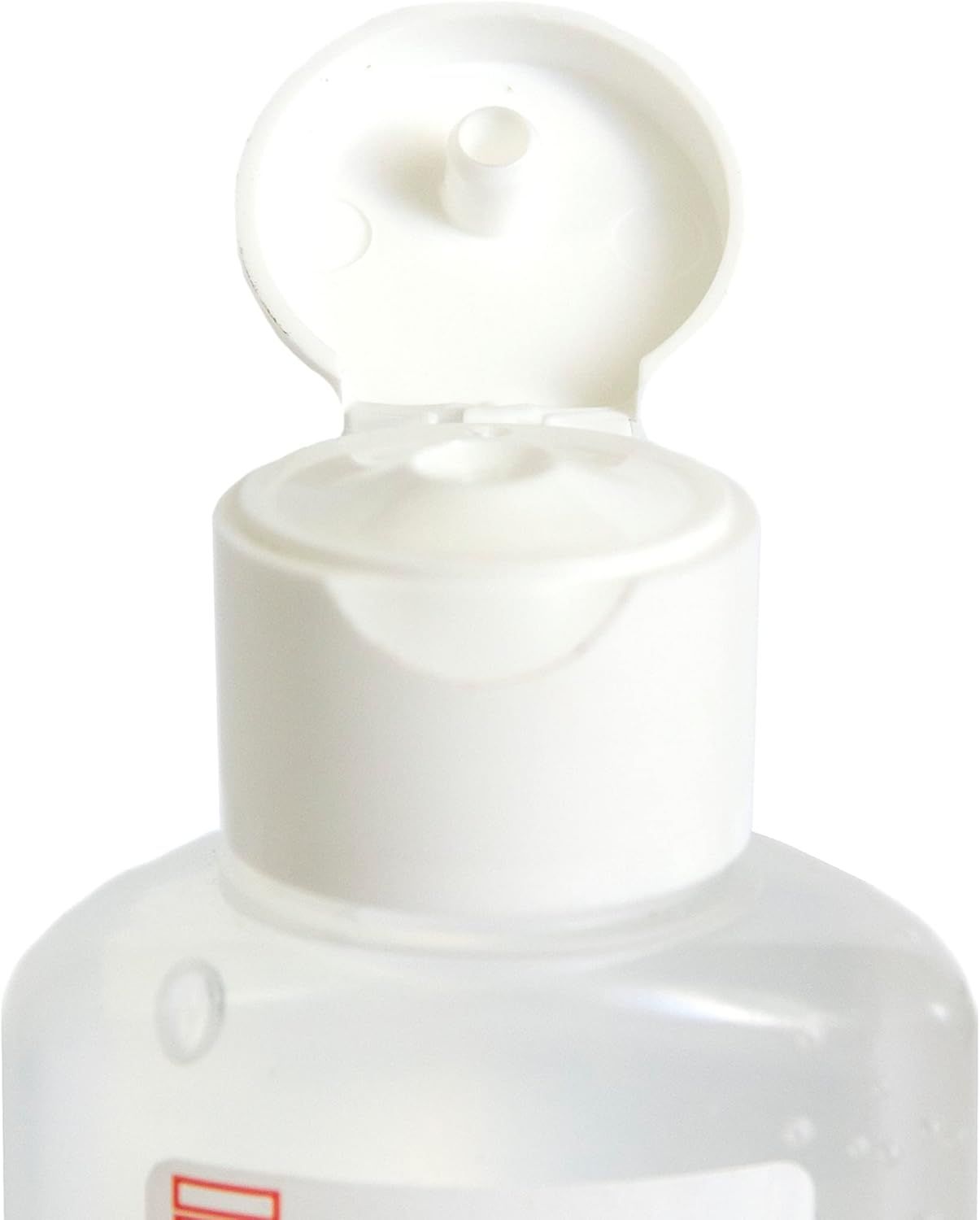 Primo piano del tappo bianco di una bottiglia. Il tappo è aperto.