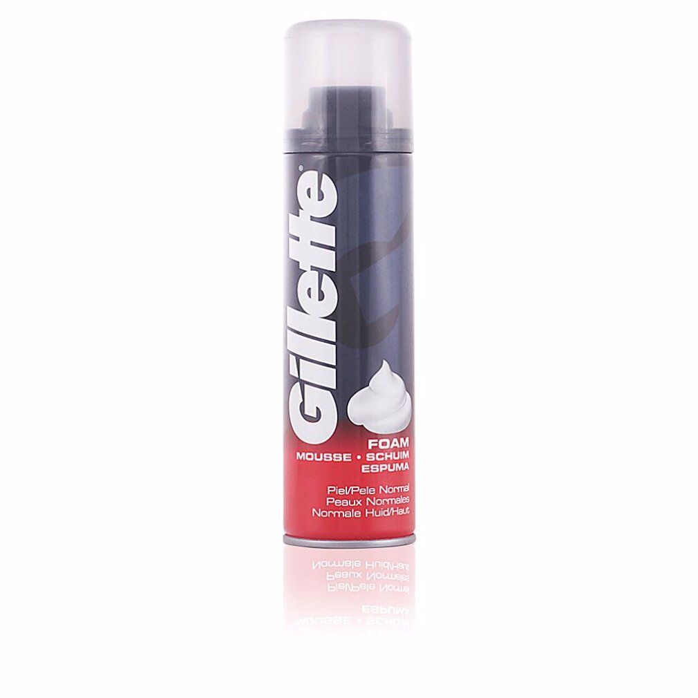 Bomboletta di schiuma da barba Gillette, rossa e nera, con schiuma bianca. Testo: Gillette, Mousse, Foam, Espuma, Peau Normale.