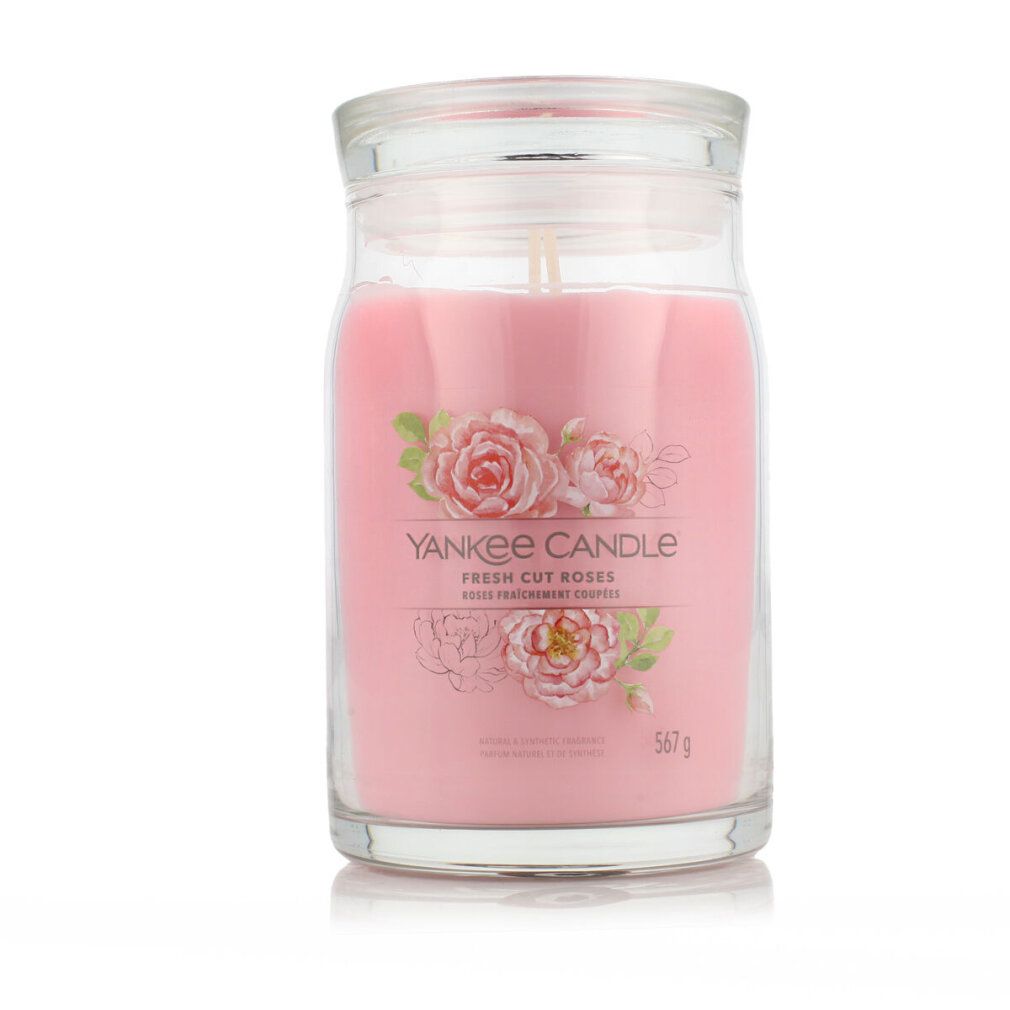 Yankee Candle con coperchio. Cera rosa, uno stoppino. Etichetta con rose e scritta 'Fresh Cut Roses'.