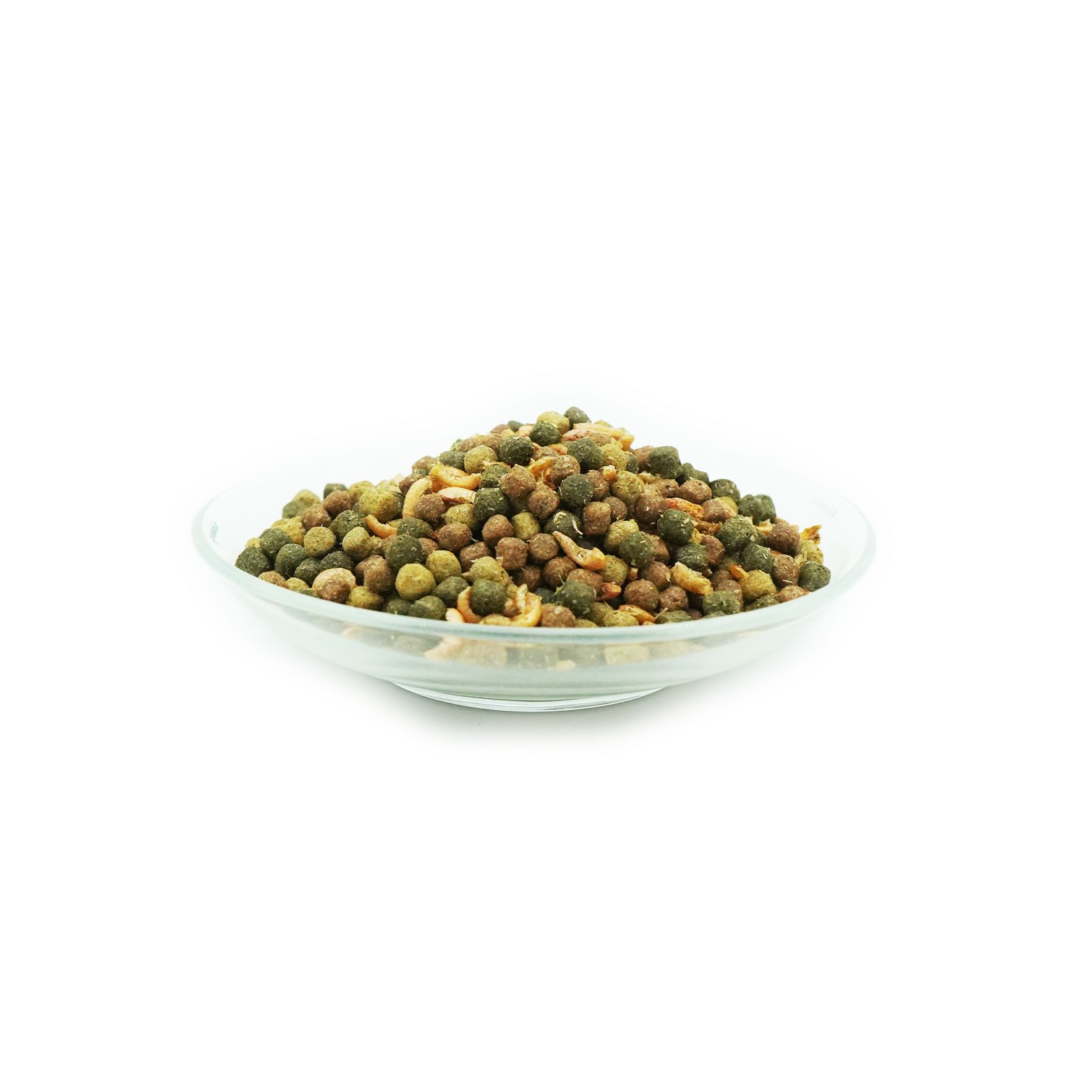 Mangime per pesci in una ciotola di vetro. Vari colori e forme. Piccoli pellet rotondi.