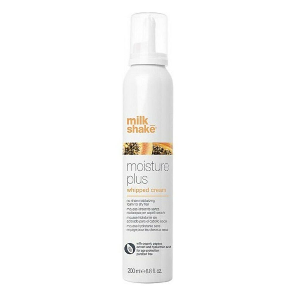Spray bianco con nome e designazione del prodotto. Scritta: Milk Shake Moisture Plus Whipped Cream. Con estratto di papaya.