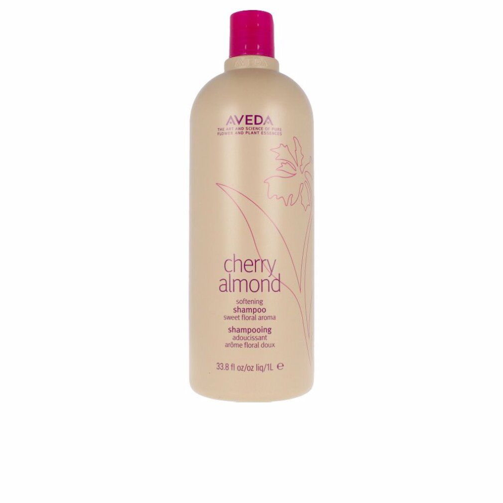 Flacone di shampoo beige con tappo rosa. Scritta: Aveda, Cherry Almond, Shampoo. Design floreale.