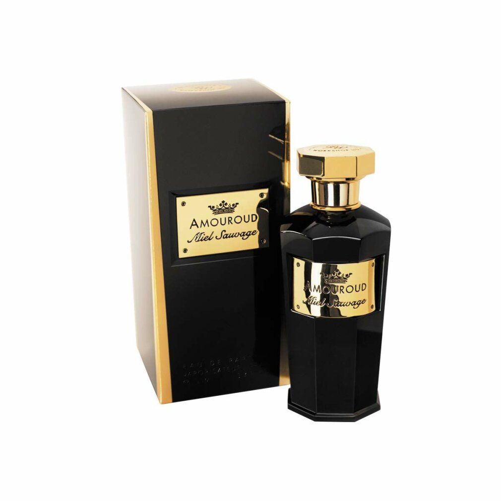 Flacone nero con tappo ed etichetta dorati. Confezione nera con dettagli dorati. Testo: Amouroud Miel Sauvage.