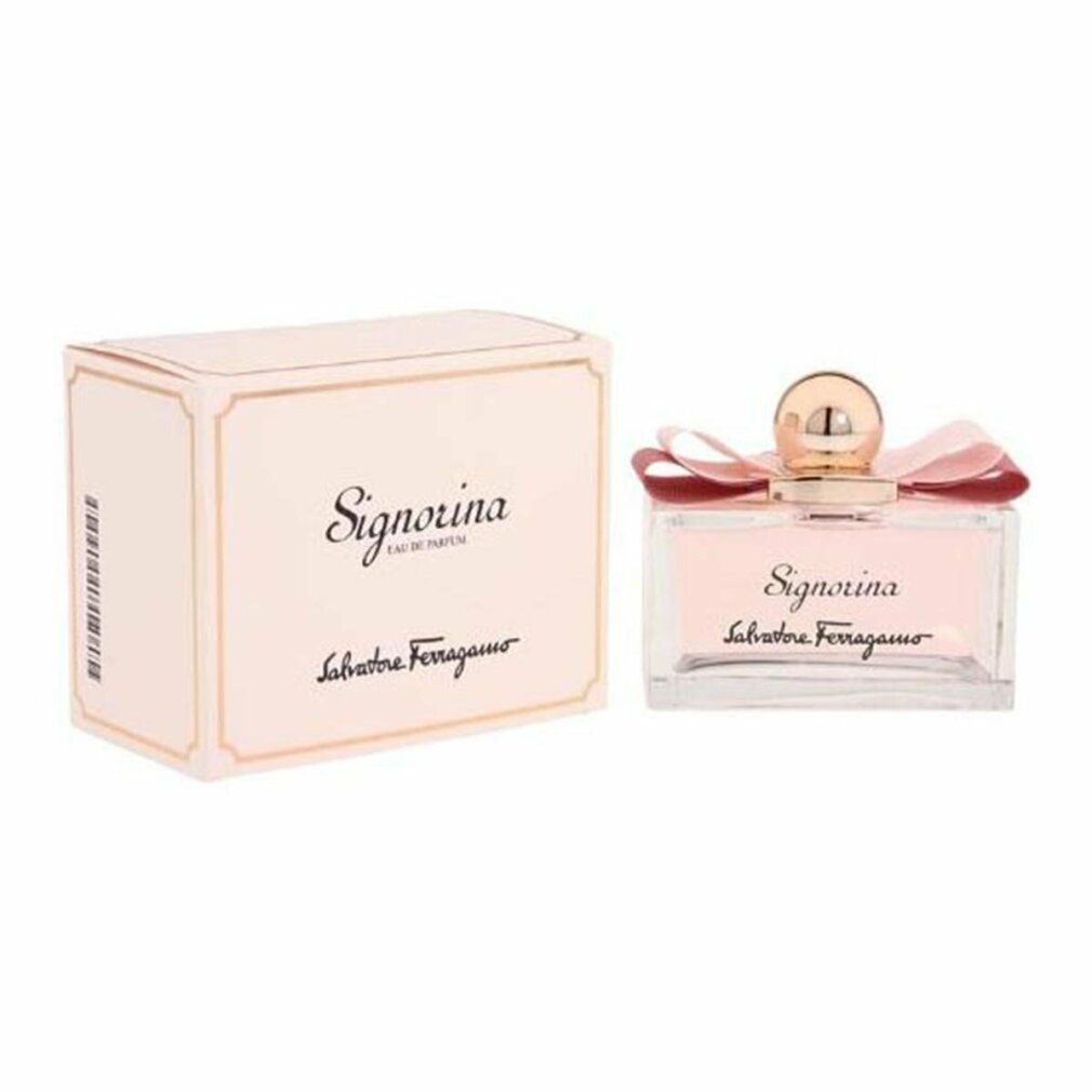 Flacone di profumo e confezione. Flacone con liquido rosa, fiocco e tappo dorato. Confezione con scritta Signorina.