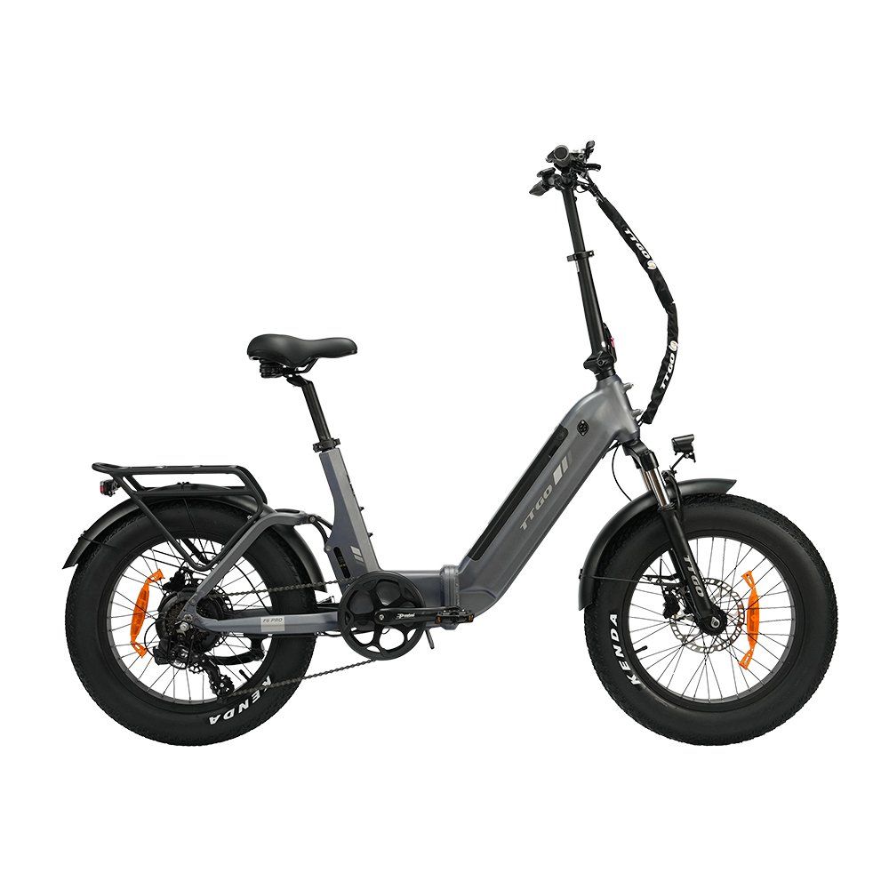 E-bike pieghevole grigia con pneumatici neri e dettagli arancioni. Dotata di portapacchi e freni a disco idraulici.
