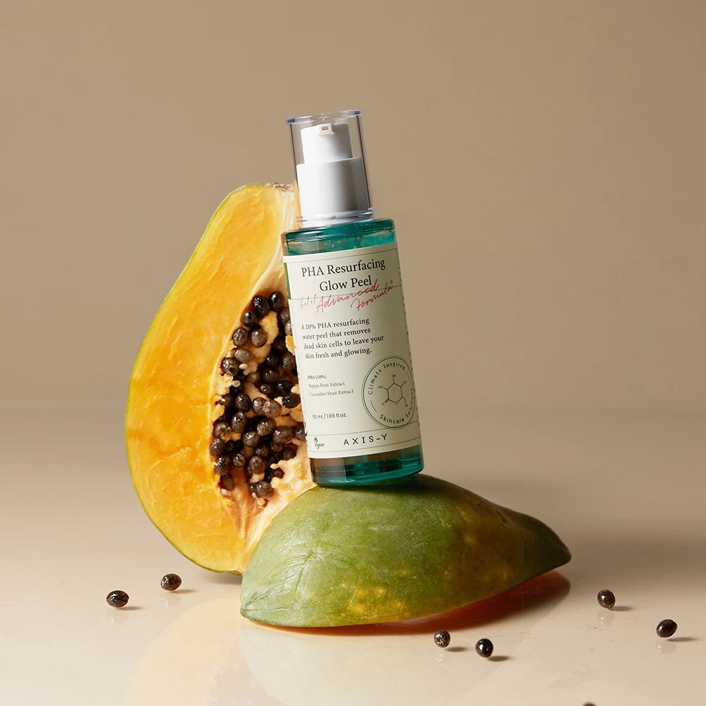 Flacone AXIS-Y PHA Resurfacing Glow Peel con papaya e avocado. Liquido verdognolo, dispenser bianco.