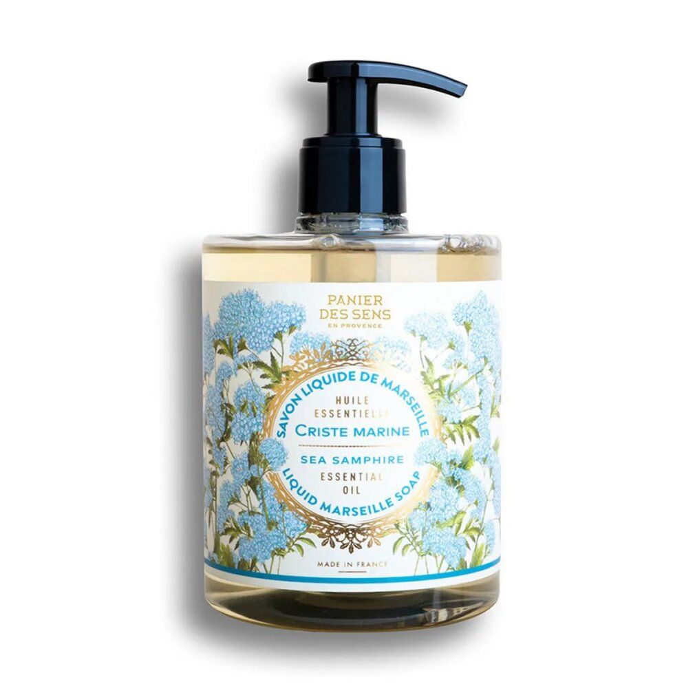 Sapone liquido in flacone rettangolare con dosatore nero. Etichetta floreale con nome del prodotto e indicazioni.