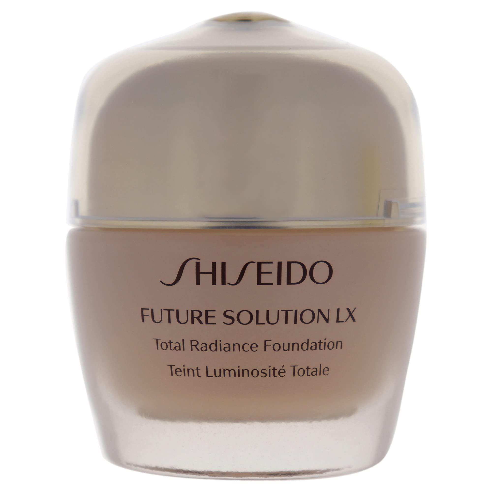 Fondotinta beige in un contenitore di vetro con coperchio dorato. Scritta Shiseido Future Solution LX.