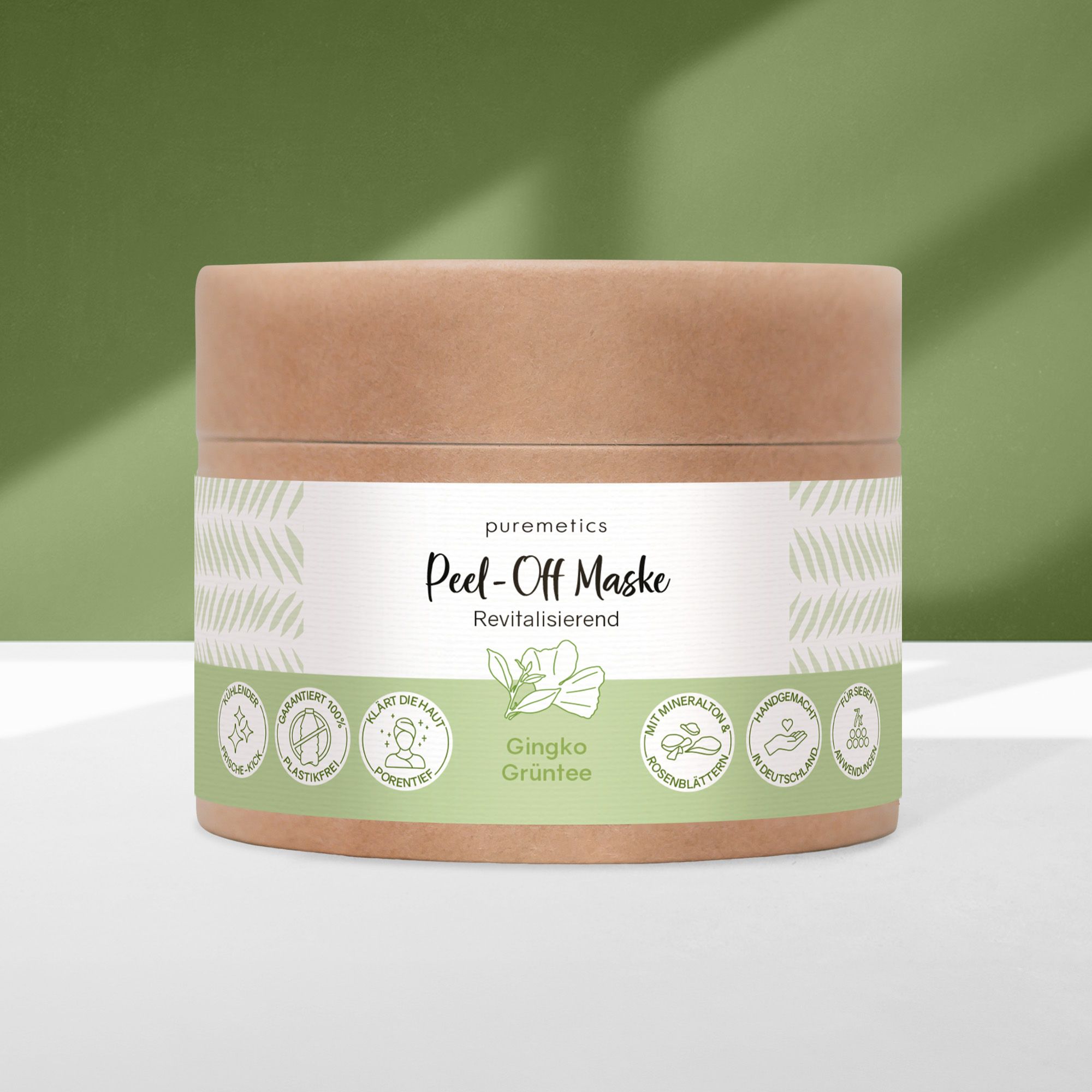 Confezione cilindrica con etichetta bianca. Scritta: puremetics Peel-Off Maske. Verde e marrone. Con Ginkgo & Grüntee.