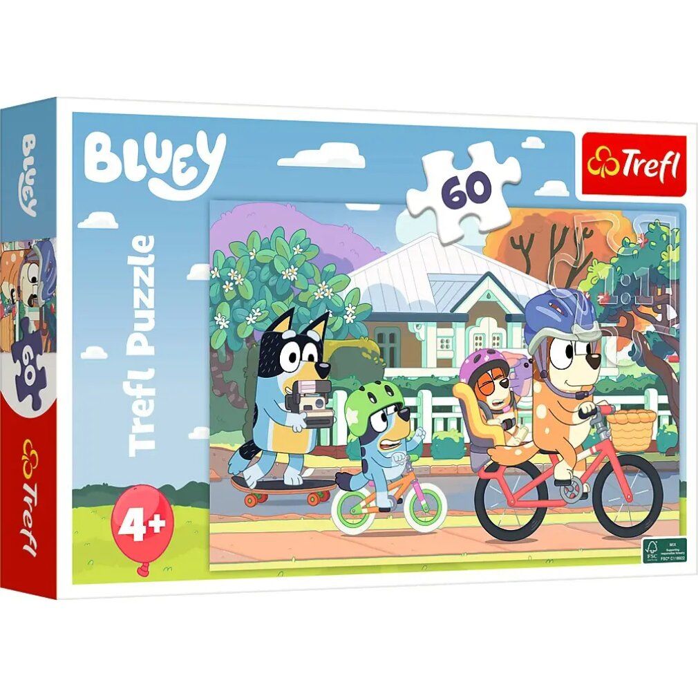 Scatola di puzzle con illustrazione di Bluey. Mostra personaggi in bicicletta e sullo skateboard. Contiene 60 pezzi, consigliato per i 4+.