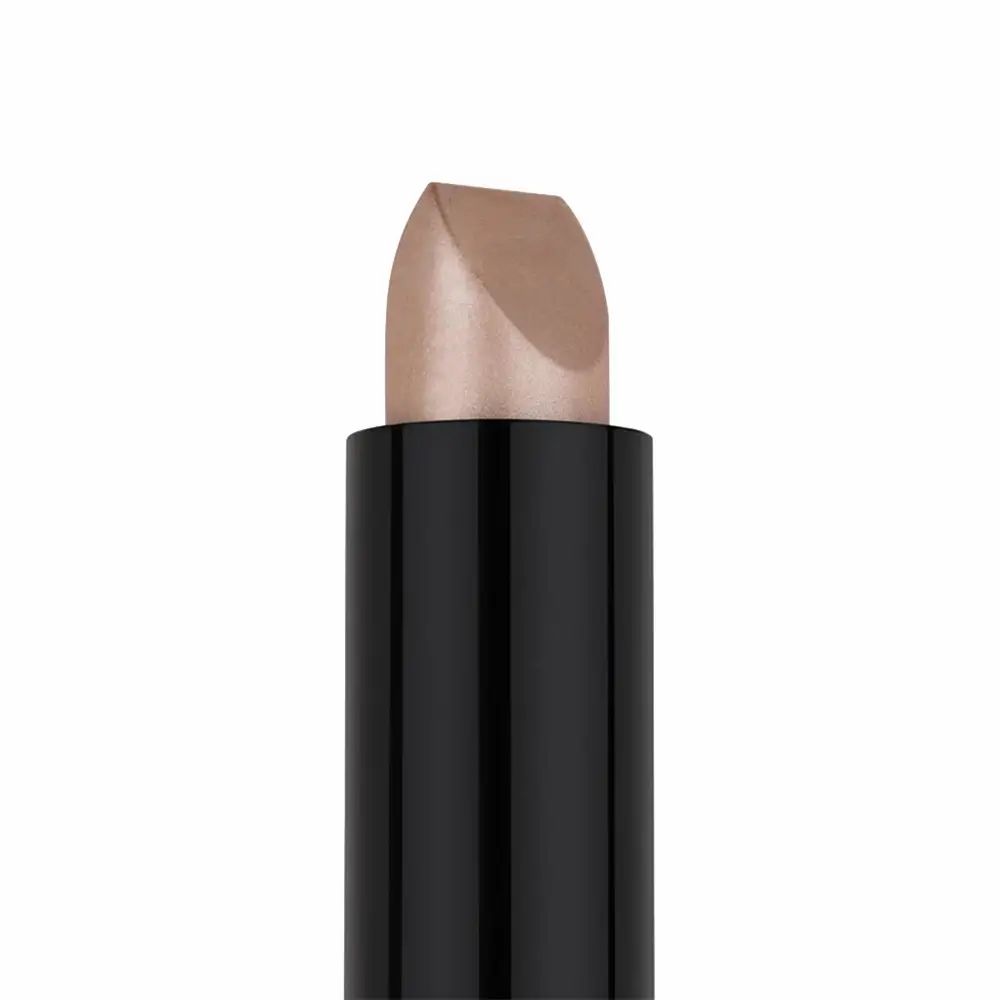 Primo piano di uno stick nero con una punta color champagne. La punta è smussata.