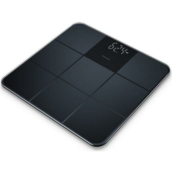 Bilancia digitale nera. Marchio Beurer. Mostra 62,4 kg. Forma quadrata con nove sezioni. Superficie in vetro.
