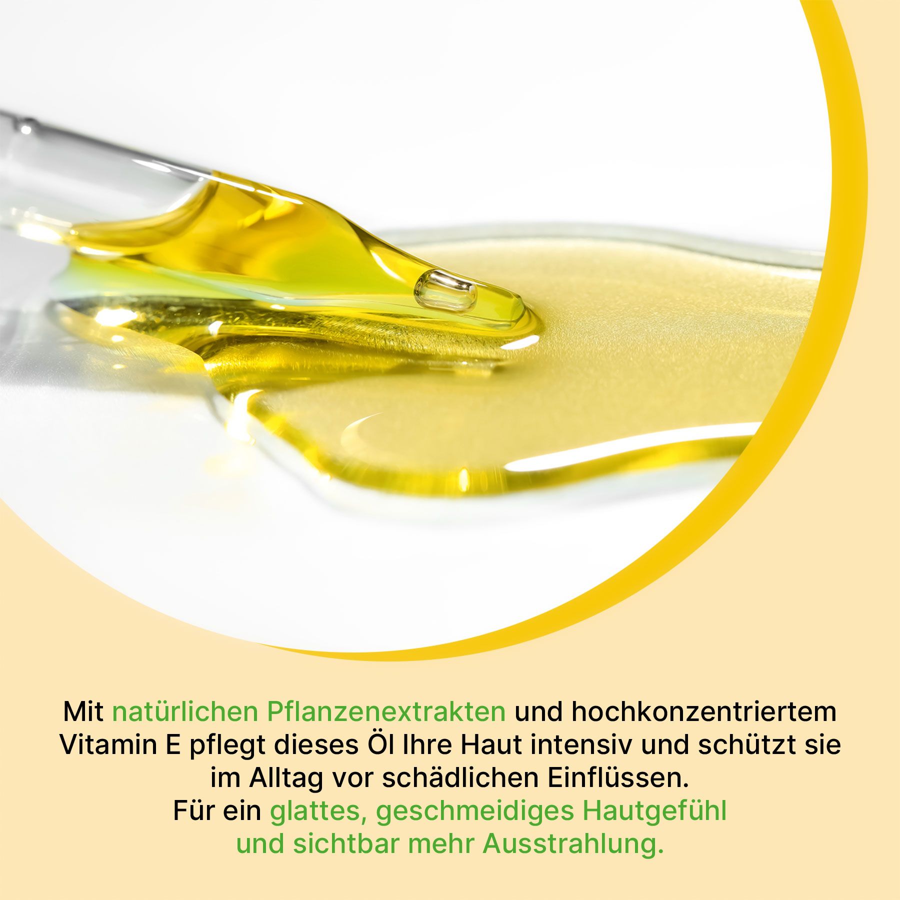Un contagocce di vetro deposita olio dorato su una superficie bianca.