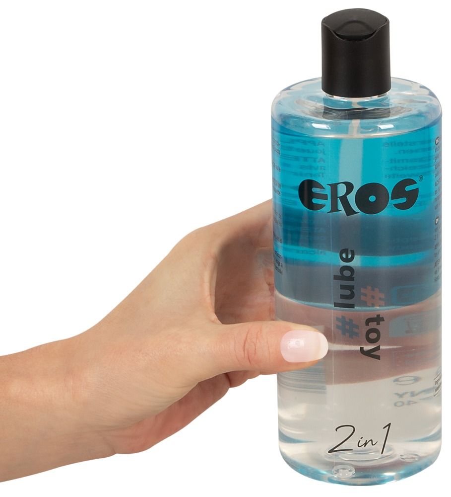 Flacone trasparente con tappo nero. Scritte: EROS, #lube, #toy, 2in1. Liquido blu nella parte superiore.