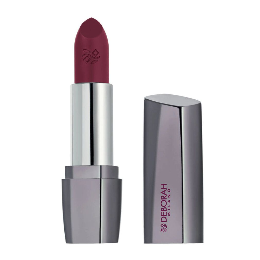 Rossetto con astuccio aperto. Rossetto rosso scuro, astuccio argentato. Deborah Milano è scritto sull'astuccio.