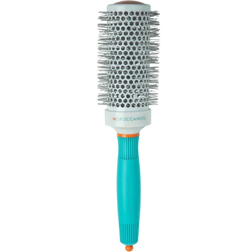 Spazzola tonda Moroccanoil con manico turchese e fusto argentato a nido d'ape.
