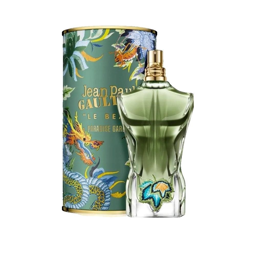 Flacone di profumo a forma di busto, accanto a confezione cilindrica con motivi floreali e scritte.