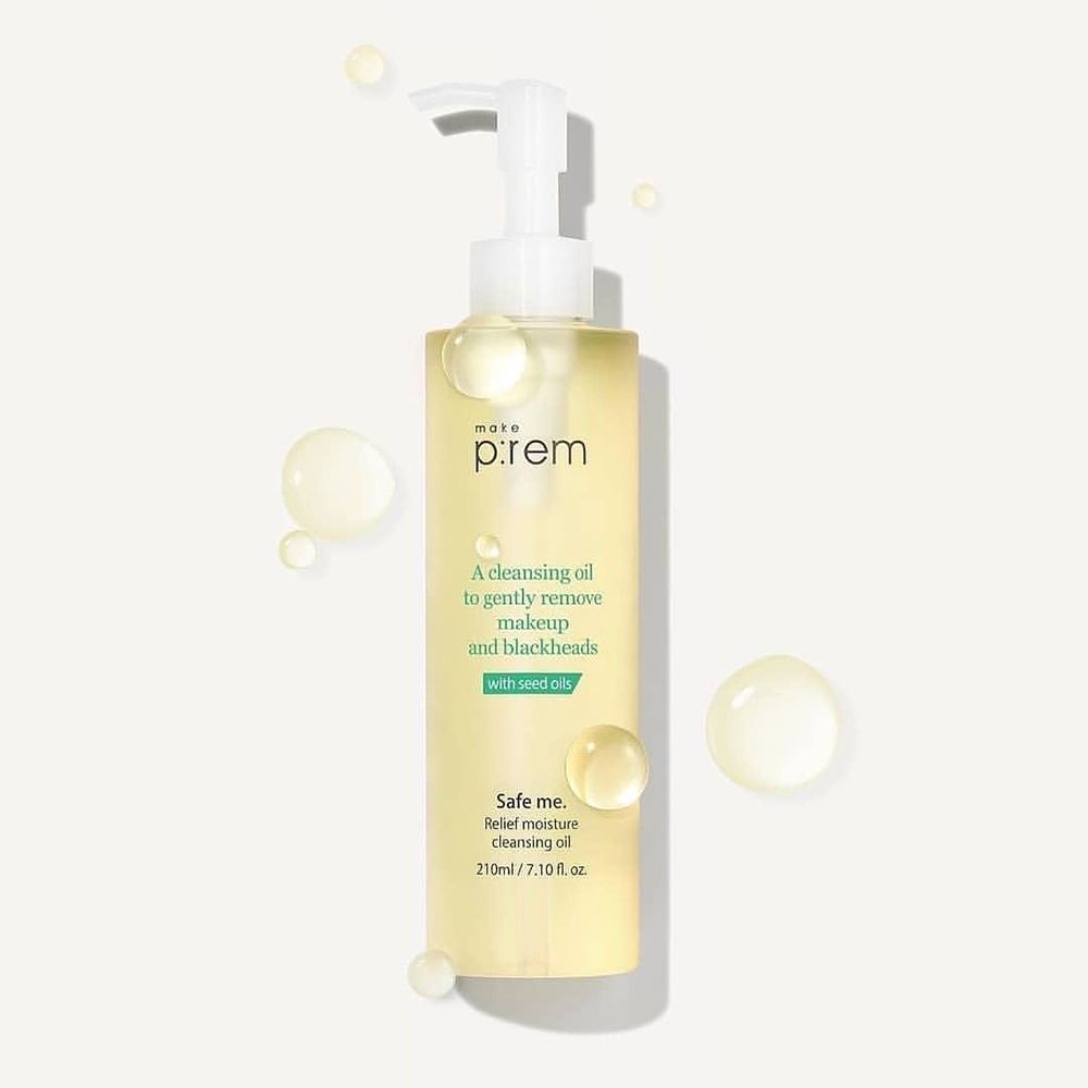 Flacone trasparente con pompa. Scritta: prem, A cleansing oil to gently remove makeup and blackheads, Safe me. Con gocce d'olio.