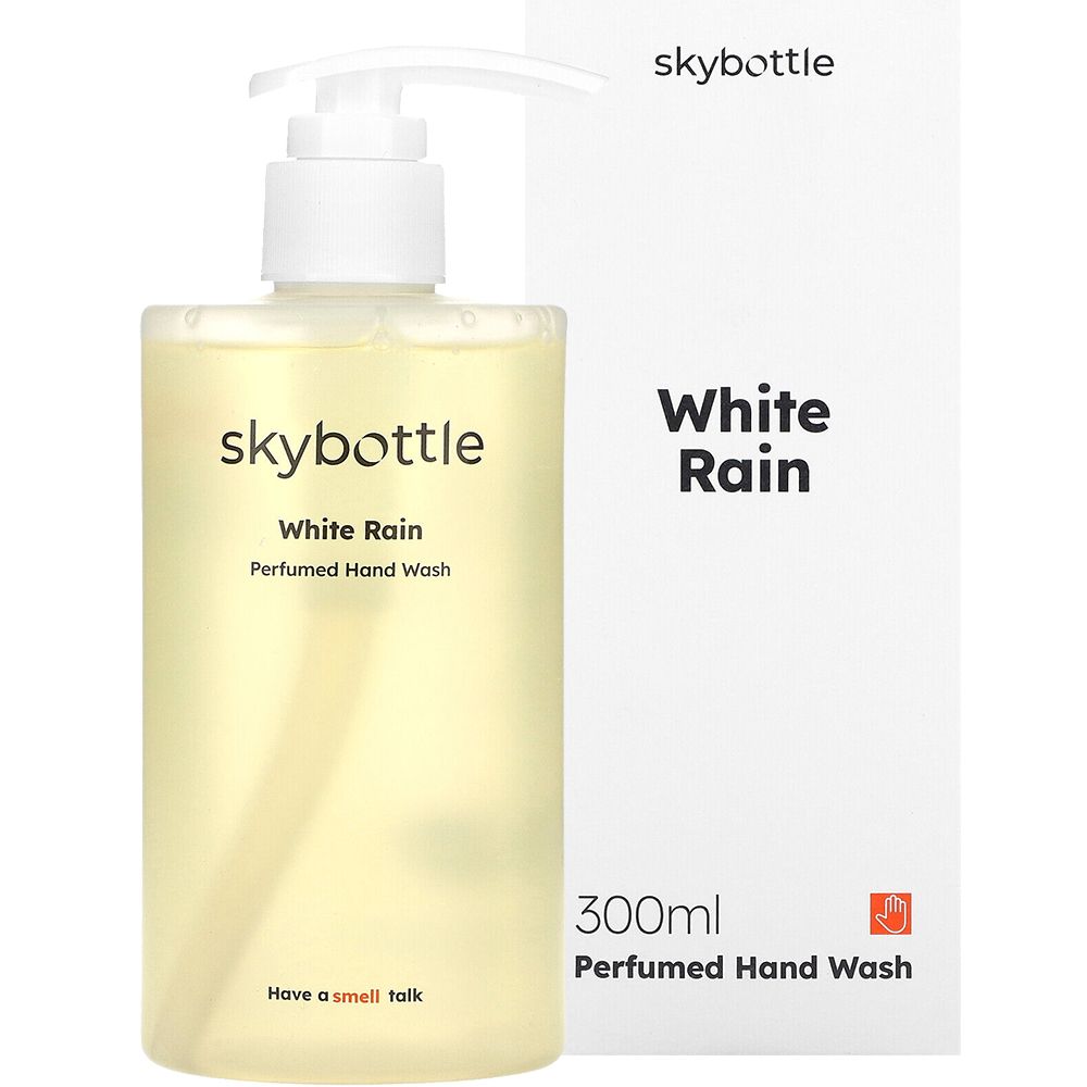 Sapone per le mani SKYBOTTLE White Rain con confezione. Flacone trasparente con dosatore, scatola bianca con nome del prodotto.