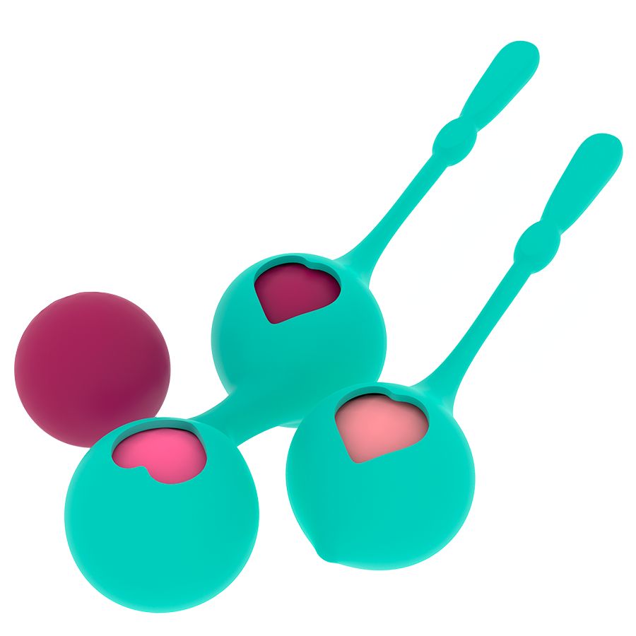 Primo piano di due sfere del piacere turchesi con foro a cuore e inserti rosa, accanto a una singola sfera rosa.