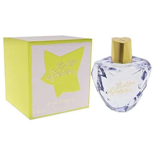 Flacone di profumo e scatola. Flacone a forma di cuore, tappo dorato. Scatola gialla con stella.