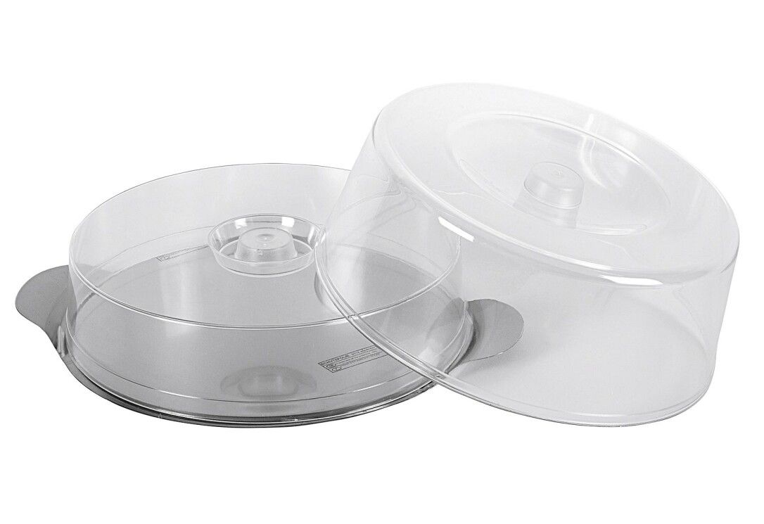 Piatto rotondo per dolci con due cupole trasparenti. Manici in metallo. Plastica. Una cupola è aperta.