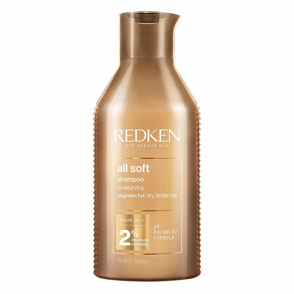 Flacone di shampoo dorato. Scritta: Redken, all soft shampoo. Contiene olio di argan e complesso idratante al 2%. Formula pH bilanciata.