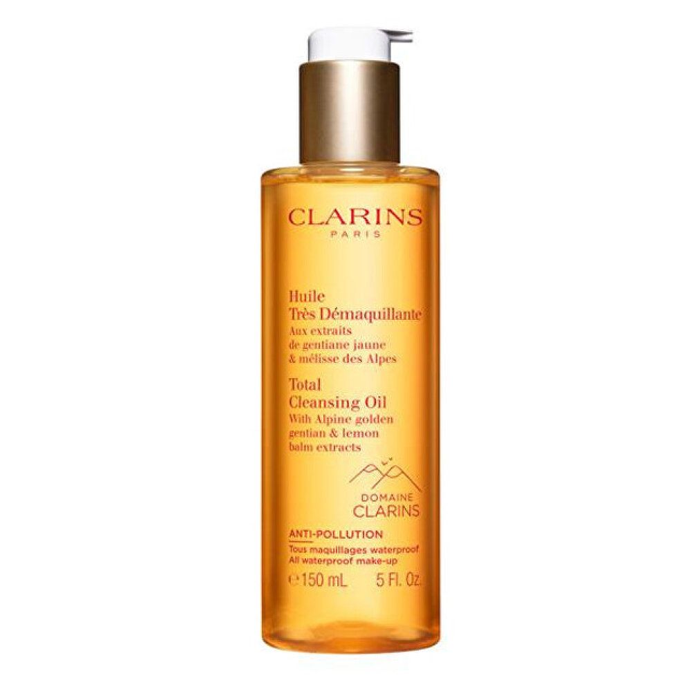 Clarins Total Cleansing Oil. Liquido giallo in bottiglia con dosatore. Scritta: Anti-pollution, 150 ml, 5 Fl. Oz.