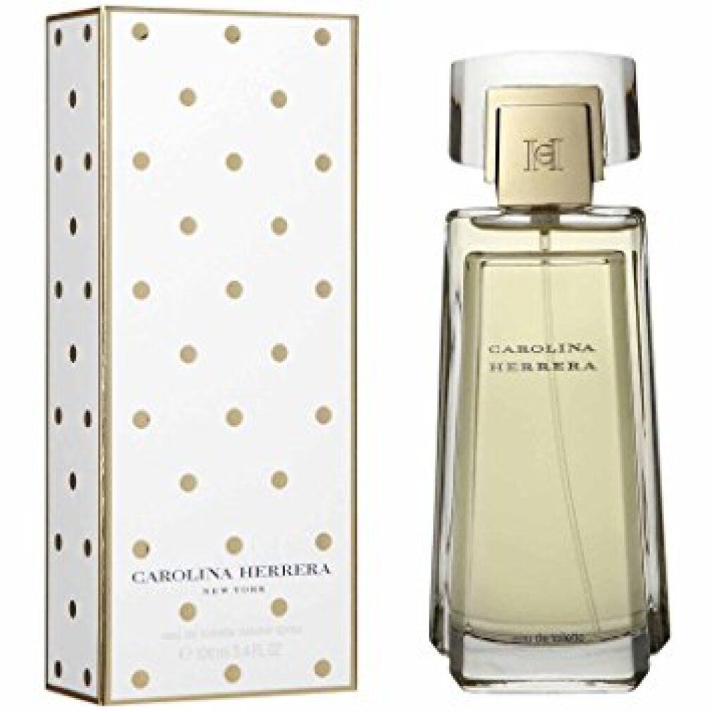 Flacone di profumo e scatola. Flacone rettangolare trasparente con tappo dorato. Scatola bianca a pois dorati e logo.