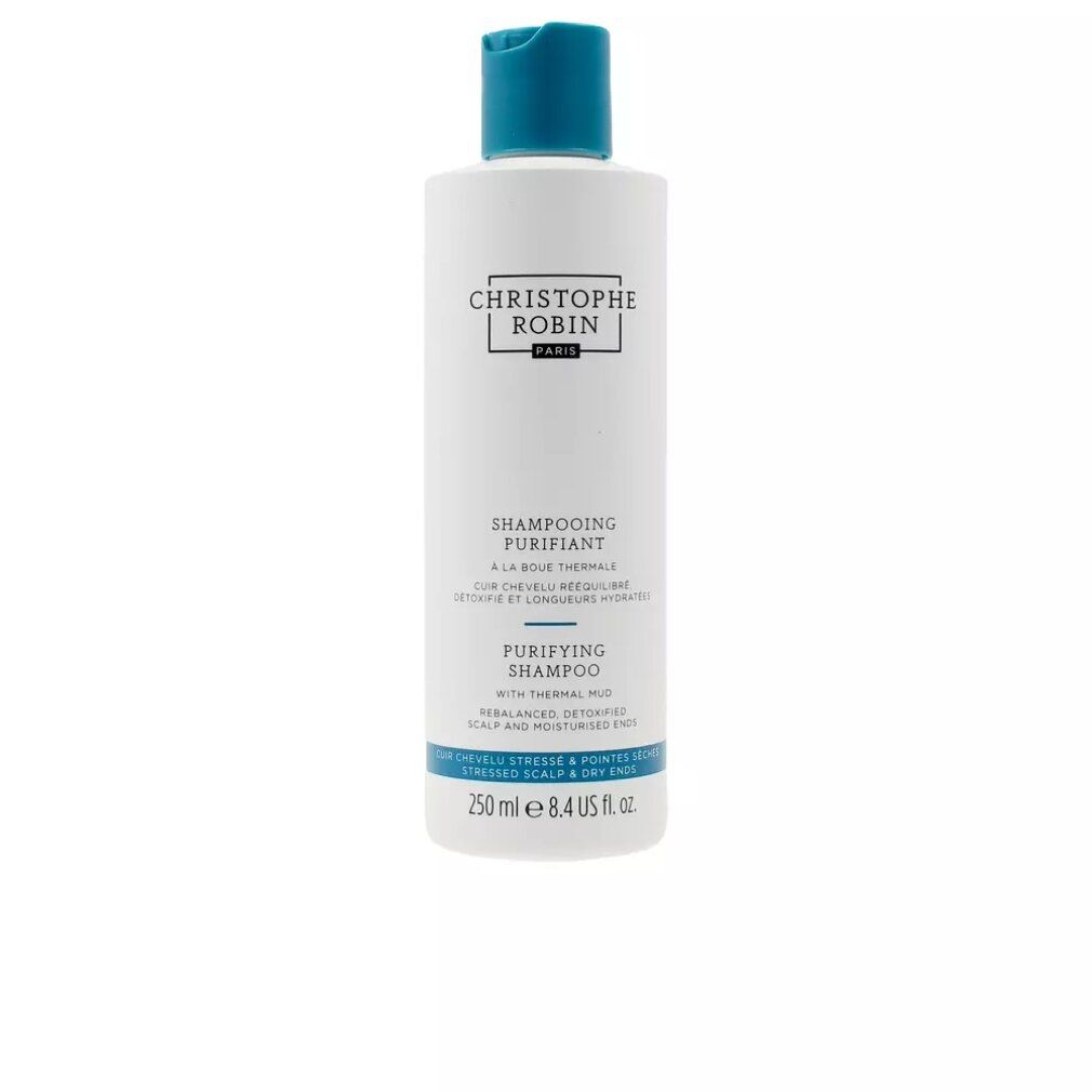 Flacone di shampoo bianco con tappo blu. Testo: Christophe Robin, Purifying Shampoo, con fango termale. 250 ml.