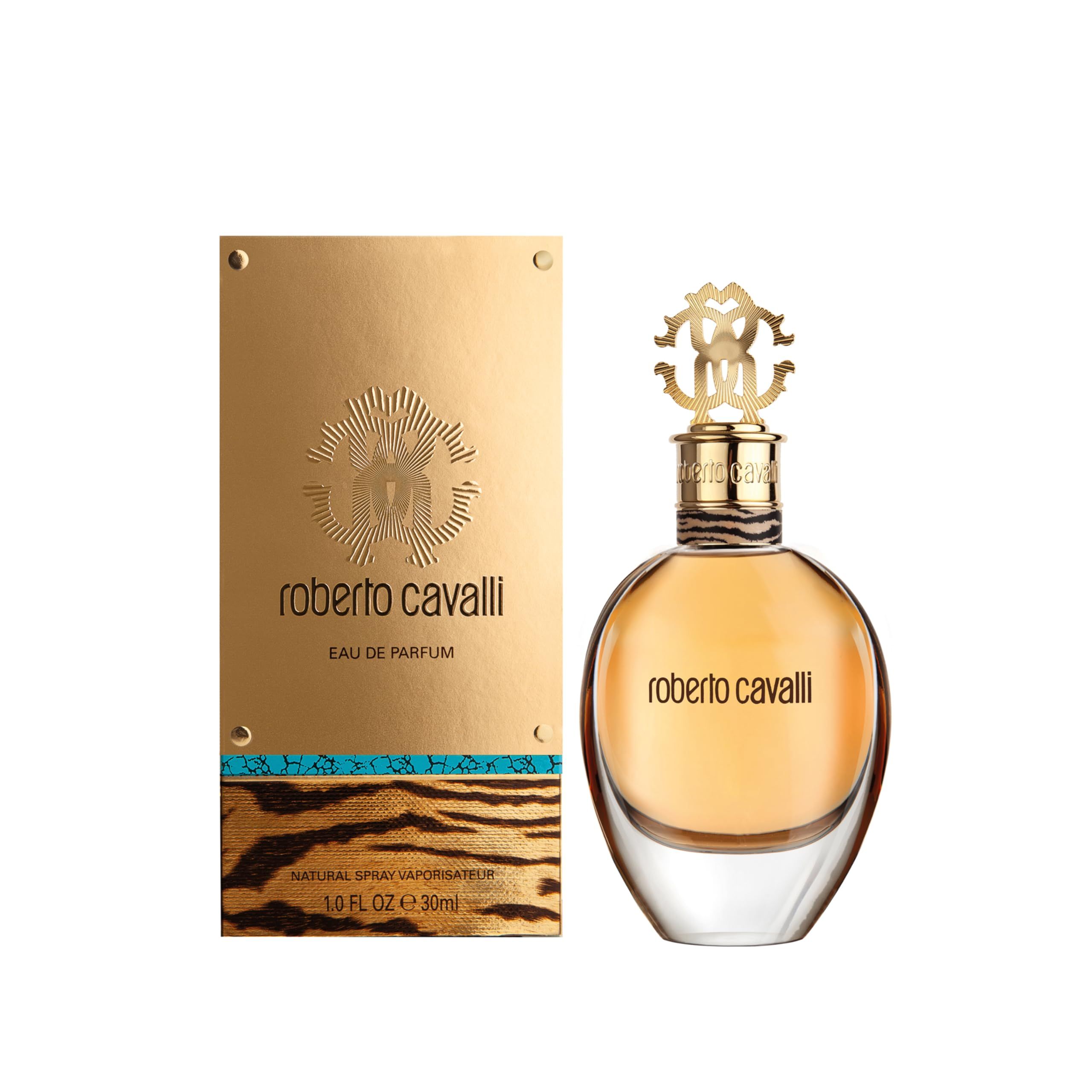 Flacone di profumo e confezione. Confezione dorata con 'roberto cavalli' e 'EAU DE PARFUM'.