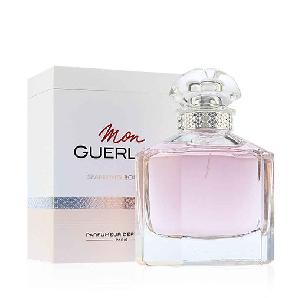 Flacone e confezione. Flacone con liquido rosa, anello argentato e tappo trasparente. Confezione con scritta "Mon Guerlain".