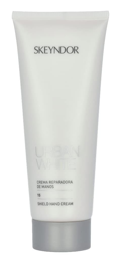 Tubo bianco Skeyndor. Testo: Urban White, Crema Reparadora de Manos, SPF 15, Shield Hand Cream. Tappo grigio.