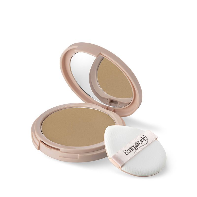 Fondotinta compatto con specchio e applicatore. Astuccio rosa, polvere beige. Applicatore con logo.