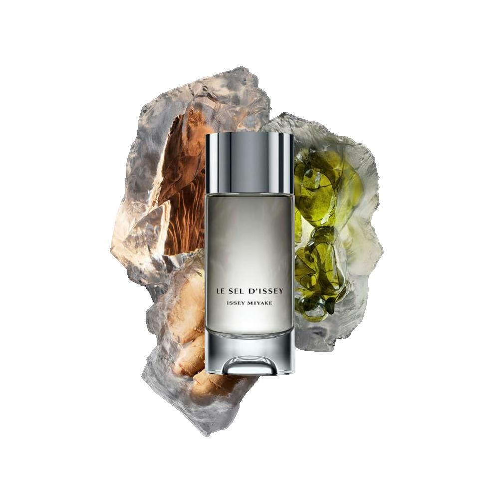 Flacone di profumo con tappo argentato, circondato da pietre ed elementi verdi. Scritta: LE SEL D'ISSEY, ISSEY MIYAKE.