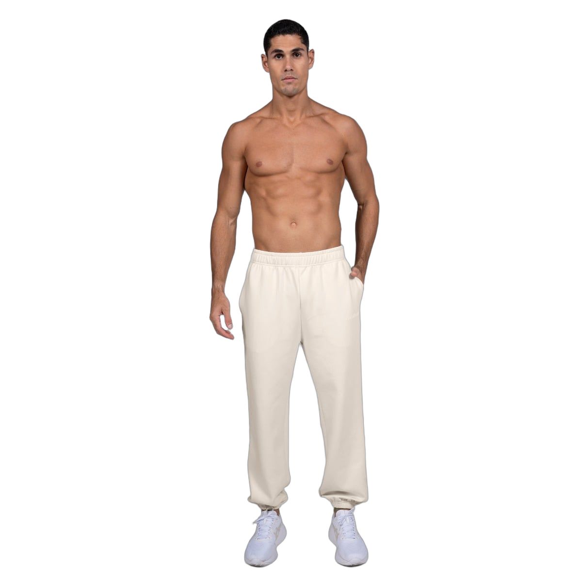 Pantaloni da jogging beige da uomo, vista frontale con elastico in vita e ai polsini.