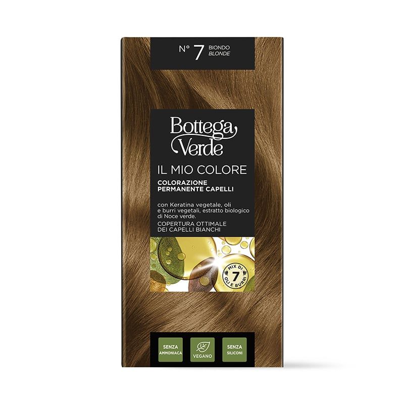 Confezione di tinta per capelli. BIONDO N7. Nome e marchio visibili. Contiene cheratina, oli vegetali ed estratto di noce biologico. Vegano.