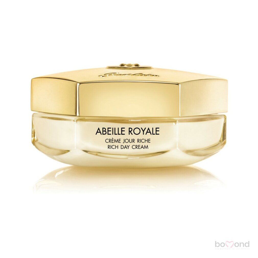 Vasetto di crema con coperchio dorato. Scritta: Abeille Royale Crème Jour Riche. Prodotto su sfondo bianco. Logo Guerlain Paris.