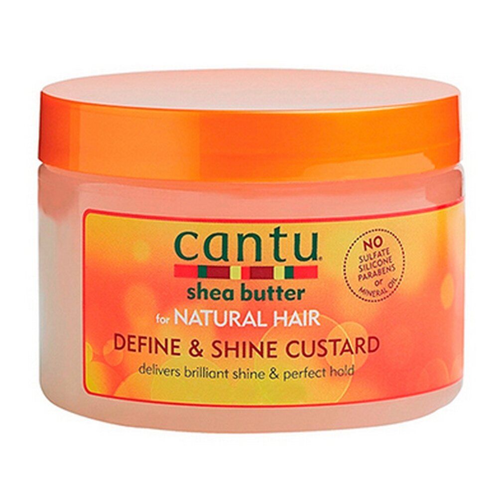 Cantu Shea Butter Define & Shine Custard per capelli naturali in un barattolo arancione.