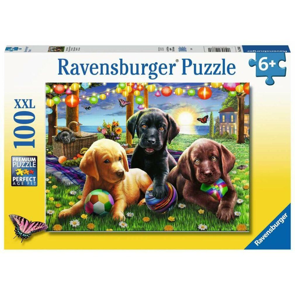 Scatola puzzle Ravensburger con tre cuccioli di Labrador. XXL 100 pezzi, consigliato 6+. Illustrazione farfalla.