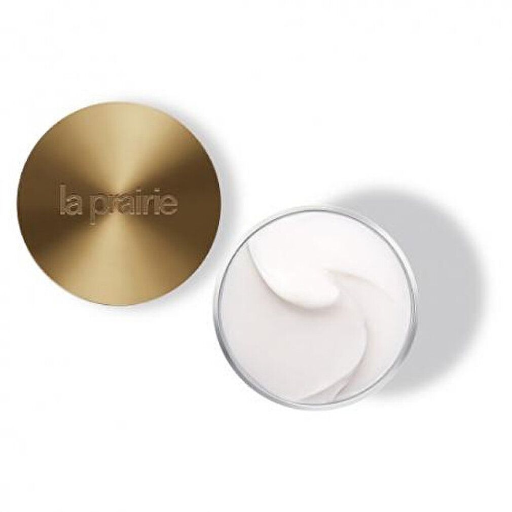 Coperchio dorato e vaso con crema. Sul coperchio è presente la scritta "la prairie".