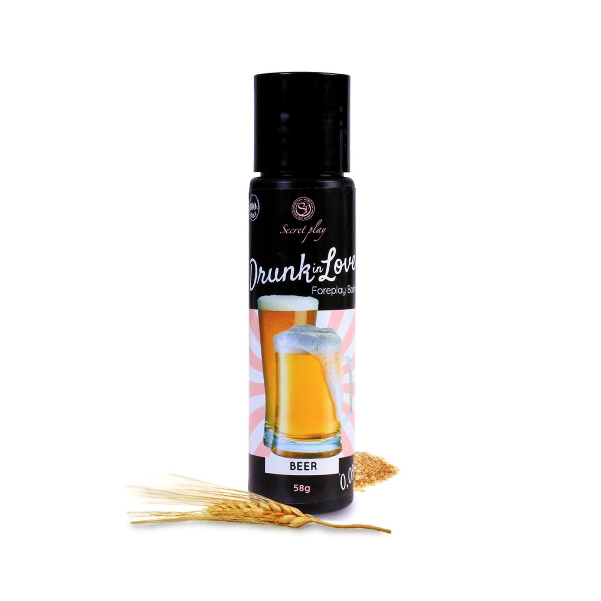 Flacone nero con "Drunk in Love Foreplay Balm". Immagine di birra. Scritta "BEER". Spighe e granaglie accanto.