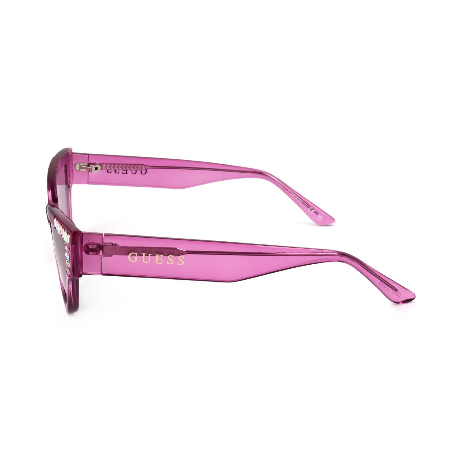 Occhiali da sole Guess rosa trasparenti con strass sulla montatura e logo dorato sul
terminale.