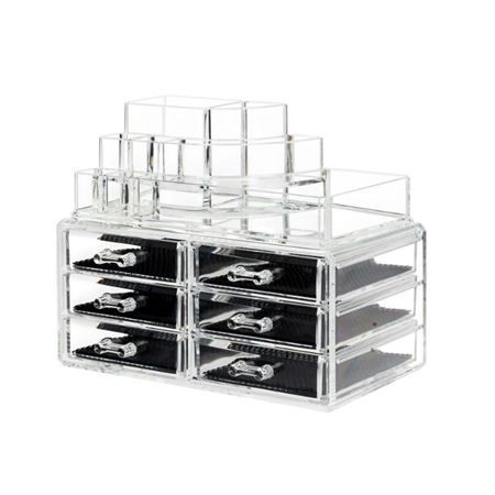 Organizzatore cosmetico trasparente vuoto con cassetti multipli e scomparti superiori per il contenimento.