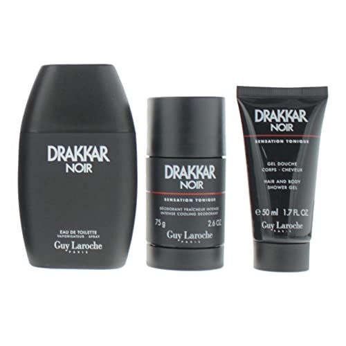 Tre prodotti cosmetici neri: Eau de Toilette, stick deodorante e gel doccia. Scritta: Drakkar Noir.