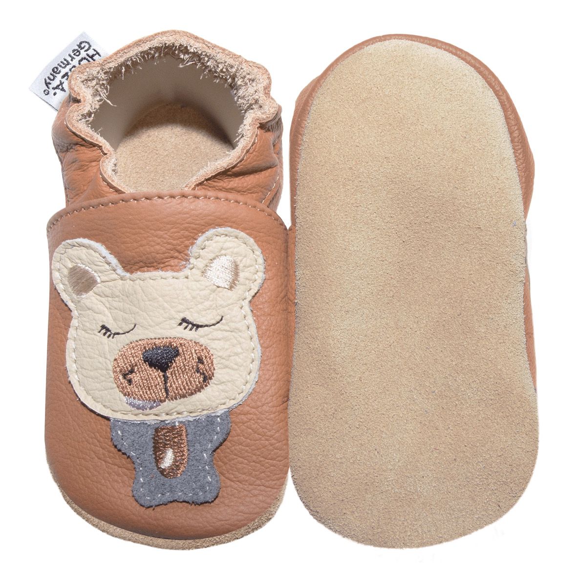 Scarpine marroni con orsetto. Una scarpa vista da sotto, suola in pelle chiara. Marchio HOBEA-Germany.