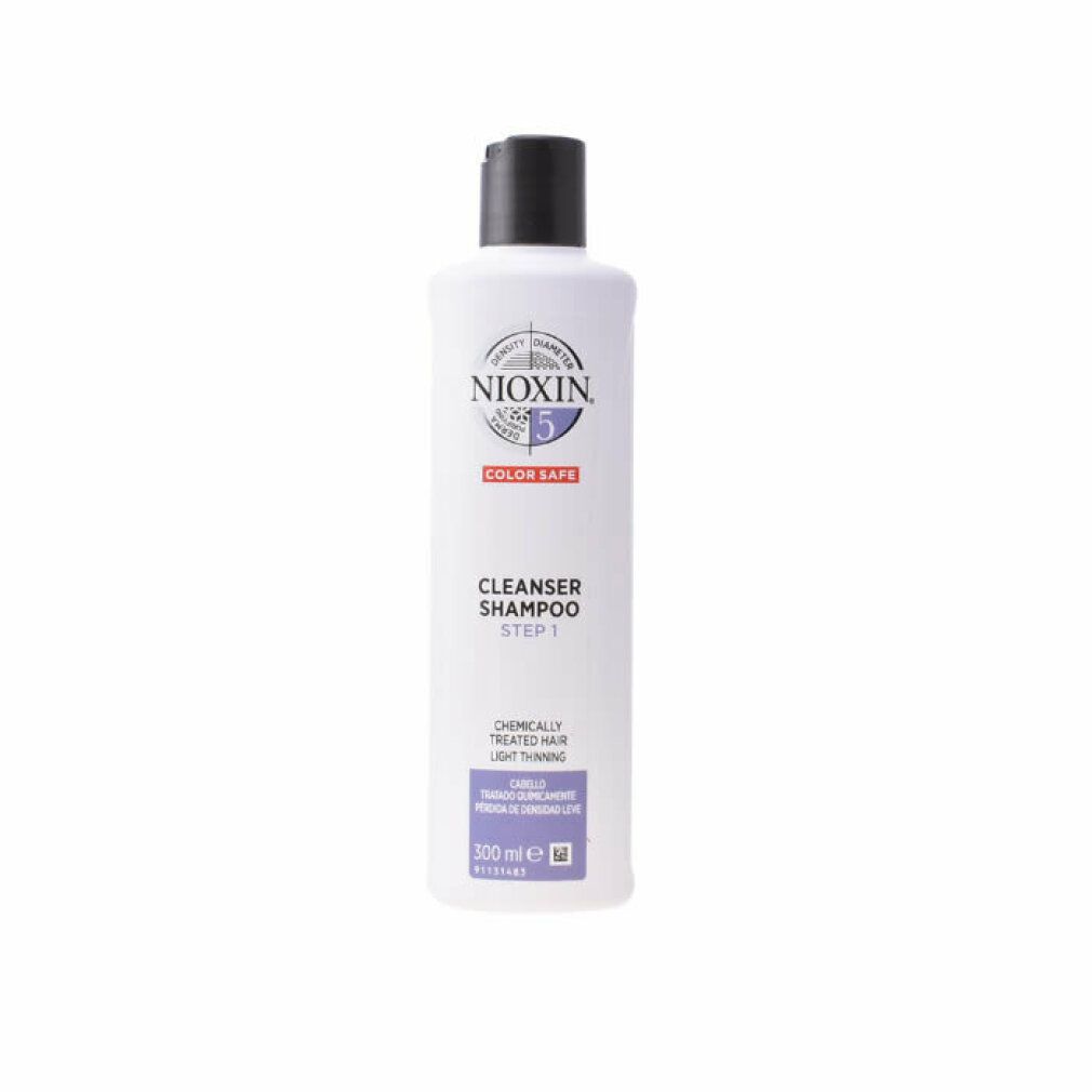 Flacone di shampoo Nioxin System 5. Etichetta bianca, tappo nero. Testo: Color Safe, Cleanser Shampoo, Step 1.
